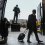 Kirk Ferentz carries a suitcase into Kinnick Stadium