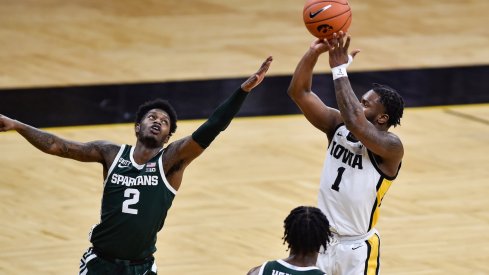 Joe Toussaint strokes a jumper over Rocket Watts