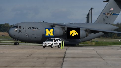 Airplane With Michigan And Iowa Logos On It