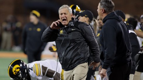 Kirk Ferentz and Brian Ferentz yelling after an Iowa penalty on an unspecified assistant coach.