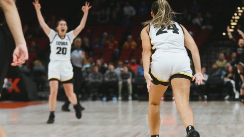Kate Martin celebrates a made three against UConn