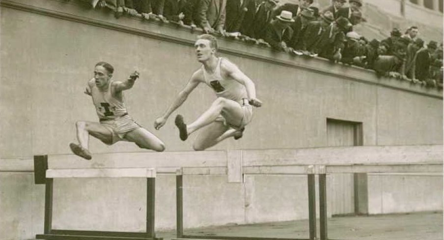 Charles Brookins clearing a hurdle circa 1924.