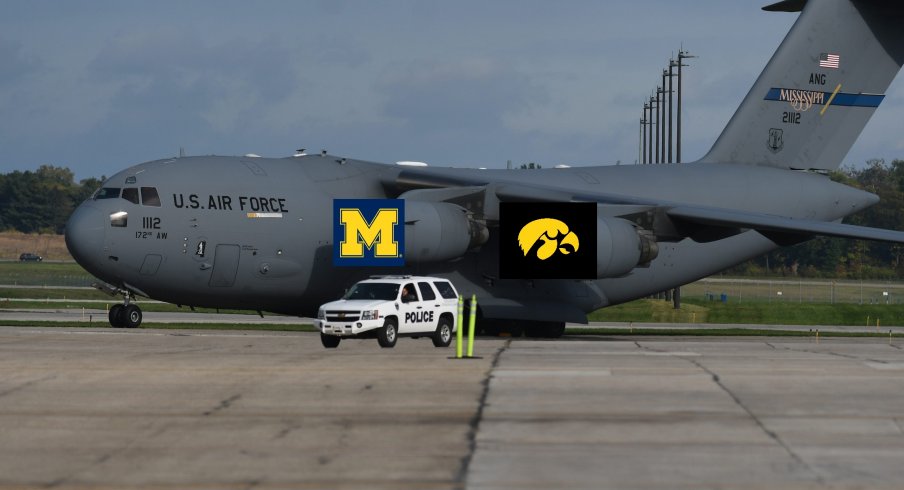 Airplane With Michigan And Iowa Logos On It