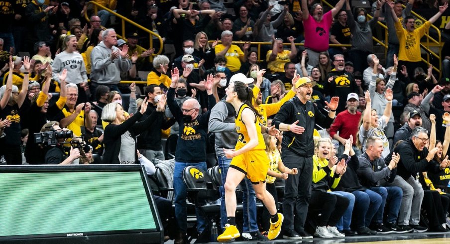 Caitlin Clark celebrates another three-pointer with the Iowa crowd