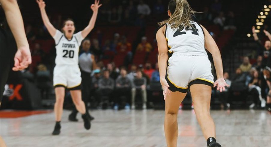 Kate Martin celebrates a made three against UConn